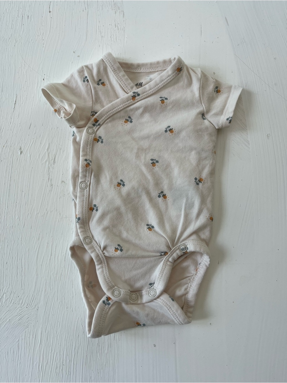 H&M Cream Baby Onesie with Small Orange & Green Fruit Motif Organic Cotton